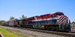 CSX Q434 northbound by the station with CN /BC Rail heritage unit 3115 leading 